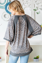 Heimish Full Size Leopard Contrast V-Neck Half Sleeve T-Shirt**